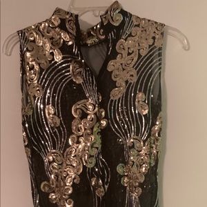 Woman black and gold dress